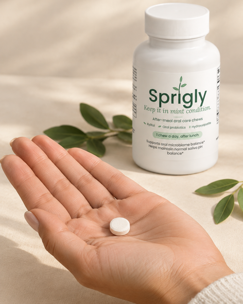 One Sprigly chewable tablet in an open hand